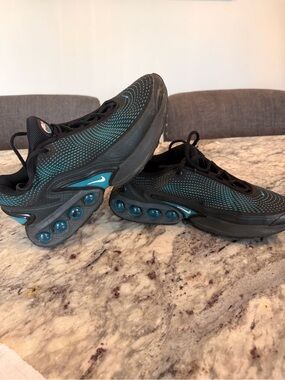 Nike Black Athletic Running Shoes with Subtle Teal Detail